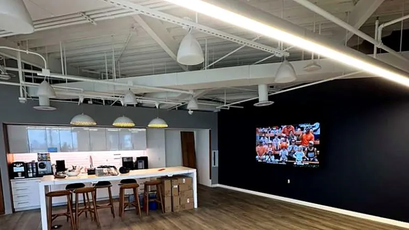 Finished office renovation with an open ceiling and kitchen island
